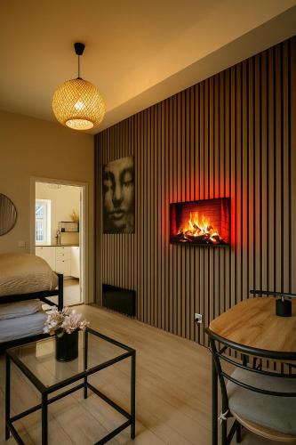 a living room with a fire on the wall at A Place To Stay Stavanger, apt 3 in Stavanger