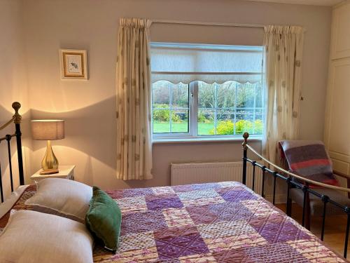 a bedroom with a bed and a window at 3 bedroom home close to Athenry in Galway in Athenry