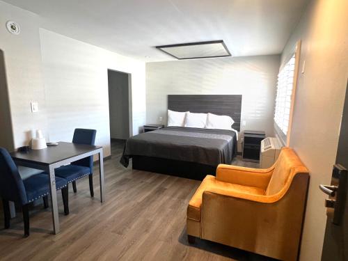 Ένα ή περισσότερα κρεβάτια σε δωμάτιο στο Cloud 9 Inn - El Ciello Inn