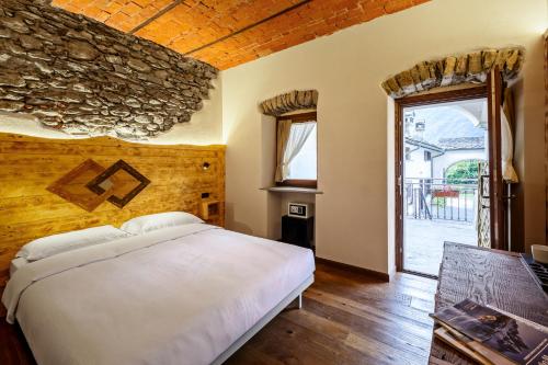 Ένα ή περισσότερα κρεβάτια σε δωμάτιο στο Domaine Valleise - Wine & Rooms