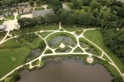 an aerial view of a park with trees and water at ZEcamping 3 étoiles dog friendly bien-être piscine au bord dun lac in Loudéac