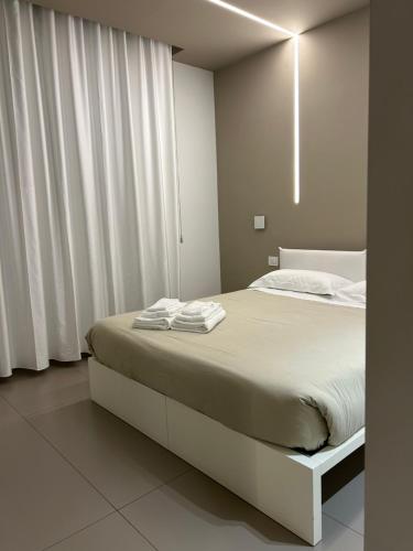 Ένα ή περισσότερα κρεβάτια σε δωμάτιο στο NINFEA sweethome