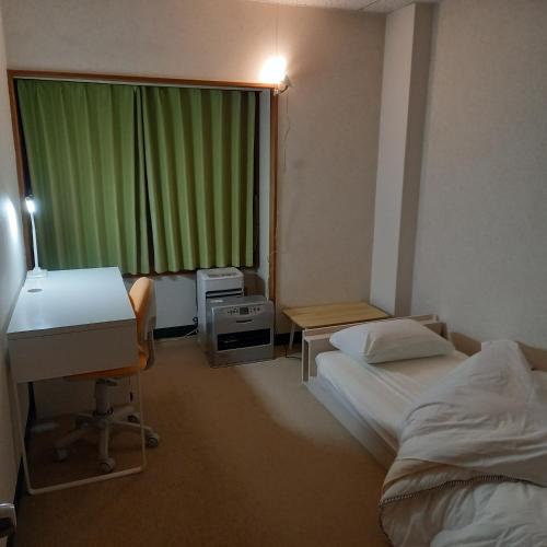 Ένα ή περισσότερα κρεβάτια σε δωμάτιο στο 横磐梯リロード