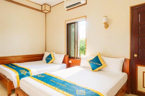 Ένα ή περισσότερα κρεβάτια σε δωμάτιο στο Hà Thành Motel Bắc Ninh