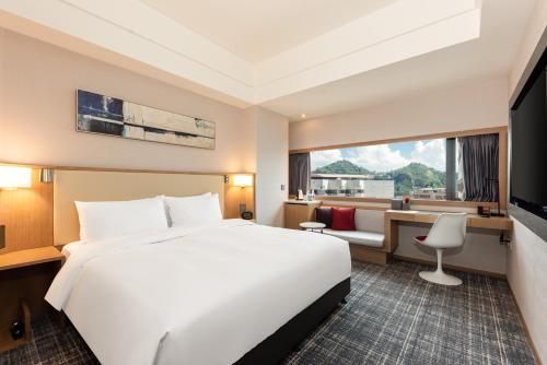 Postel nebo postele na pokoji v ubytování Xence hotel Xiamen