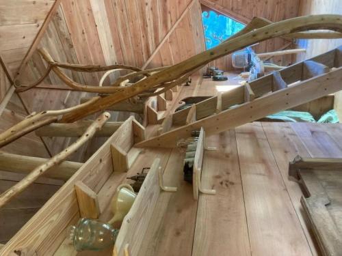 a wooden staircase in a room with a wooden floor at Camping 3 étoiles - eed0ca in Priziac