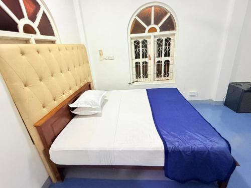 Ένα ή περισσότερα κρεβάτια σε δωμάτιο στο Trinco Hybrid Comfort Inn