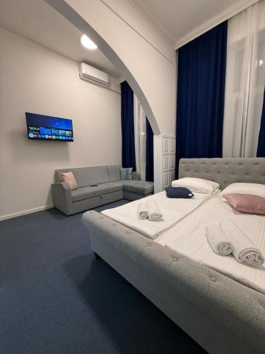 Ένα ή περισσότερα κρεβάτια σε δωμάτιο στο Royal Blue Central Point