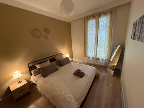 Ένα ή περισσότερα κρεβάτια σε δωμάτιο στο L'Élégance – Cosy & Chill