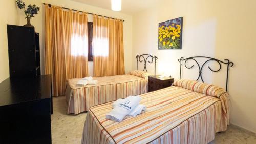 Кровать или кровати в номере Villa Carmona Benalup-Casas Viejas by Ruralidays