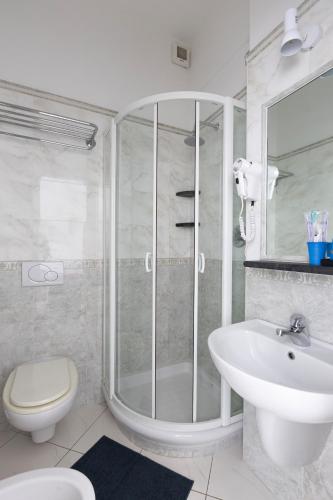 a bathroom with a shower and a toilet and a sink at Camere Margot in Monterosso al Mare