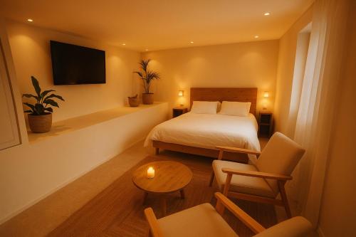 TV a/nebo společenská místnost v ubytování Ecrin des sens