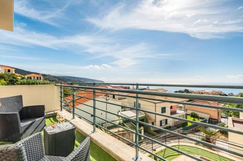 a balcony with a view of the ocean at Freitas House by Homie in Ponta do Sol