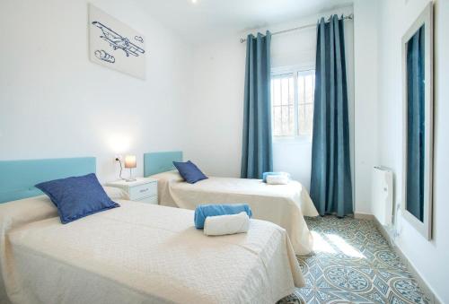 En eller flere senge i et værelse på Rancho Nicolás