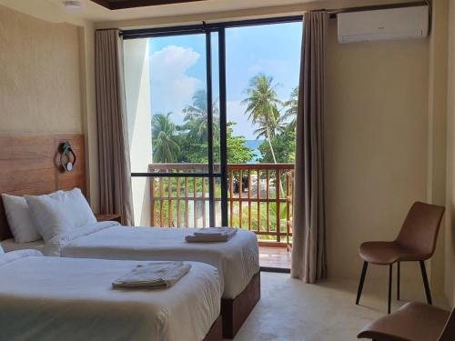 Un pat sau paturi într-o cameră la Kuredhi View