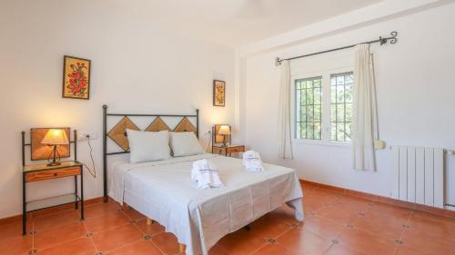 Postel nebo postele na pokoji v ubytování Finca Jaralta Carmen by Ruralidays