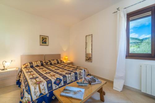 Ένα ή περισσότερα κρεβάτια σε δωμάτιο στο Casa Lucia San Teodoro 1