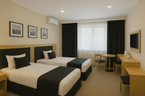 Ένα ή περισσότερα κρεβάτια σε δωμάτιο στο Level Deluxe Hotel