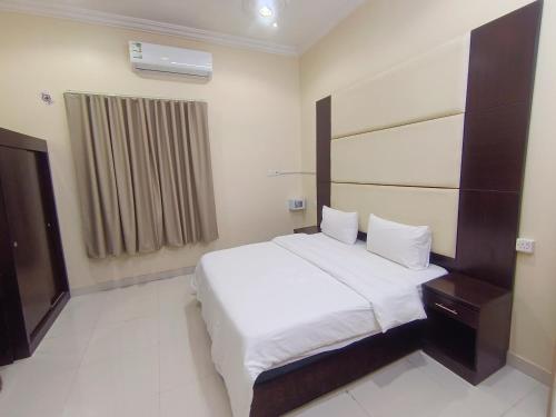 Ліжко або ліжка в номері روعة أجا للشقق المخدومة