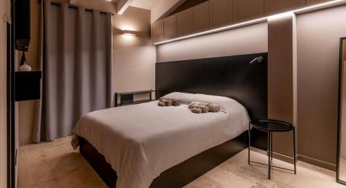 Ένα ή περισσότερα κρεβάτια σε δωμάτιο στο Baciucco Garden Suite