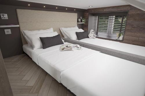 Voodi või voodid majutusasutuse The Hideaway Pets Sleeps 6 at Thurston Manor toas