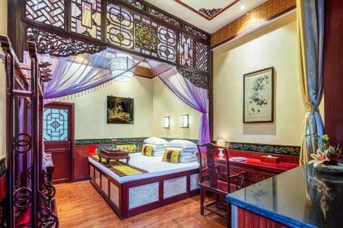 Ένα ή περισσότερα κρεβάτια σε δωμάτιο στο Pingyao Cheng Jia Hotel