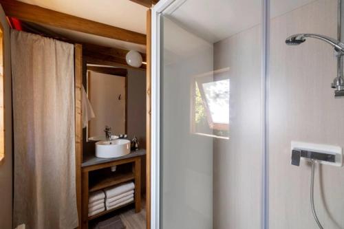 a bathroom with a shower and a sink at Camping 4 étoiles - Piscine - cbgcb0b in Saint-Jean-de-Monts