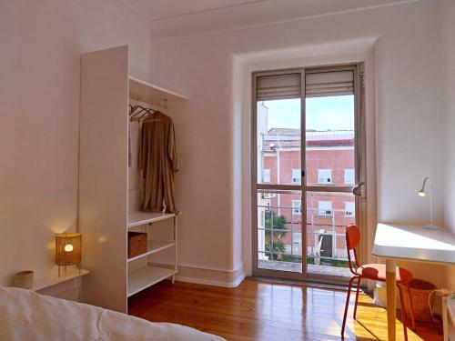 Postel nebo postele na pokoji v ubytování Stylish Cacilhas rooms near the ferry to central Lisbon