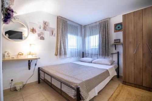 Ένα ή περισσότερα κρεβάτια σε δωμάτιο στο Prosili