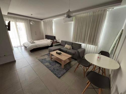 Ένα ή περισσότερα κρεβάτια σε δωμάτιο στο Thalia Residence Flats