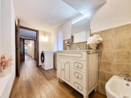 a bathroom with a sink and a white cabinet at "Suite del Borgo" charming flat at 30 min from Florence, 2 Smart TV in San Giovanni Valdarno