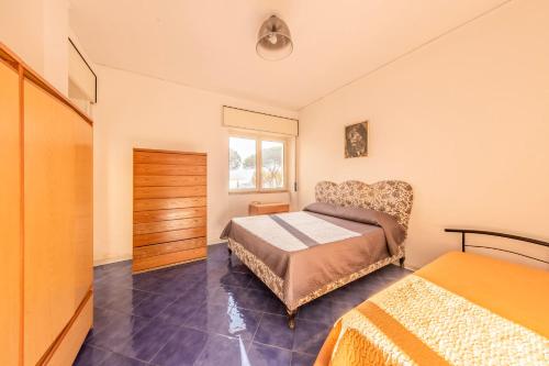 a bedroom with a bed and a window at Casa D'Amato - Nel cuore di Maiori in Maiori