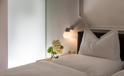 Postel nebo postele na pokoji v ubytování Hotel Spanglwirt