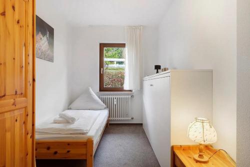 Ένα ή περισσότερα κρεβάτια σε δωμάτιο στο Fehrienwohnung Lotti