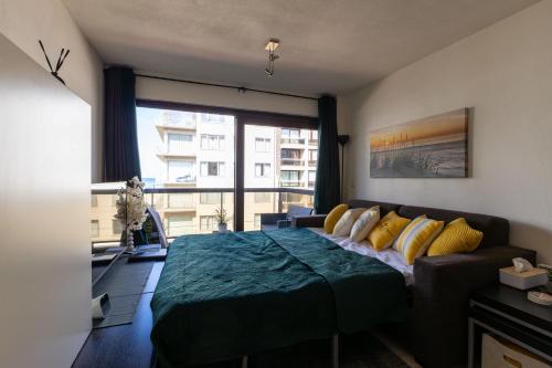 Ένα ή περισσότερα κρεβάτια σε δωμάτιο στο Siesta 0302