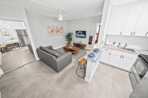 a living room with a couch and a table at Holiday Park Apartments by Lowkl in Fort Lauderdale
