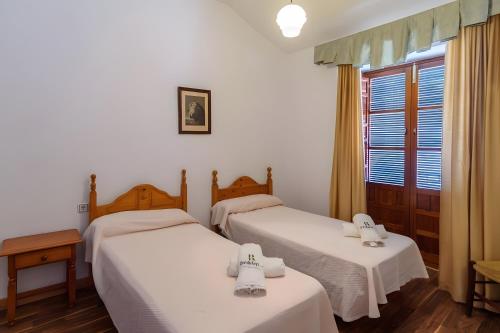 Postel nebo postele na pokoji v ubytování El Rincón Del Comendador