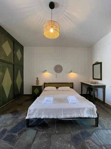 Ένα ή περισσότερα κρεβάτια σε δωμάτιο στο Casa Paros