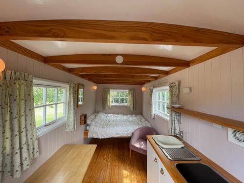 Ένα ή περισσότερα κρεβάτια σε δωμάτιο στο Riverside Retreat