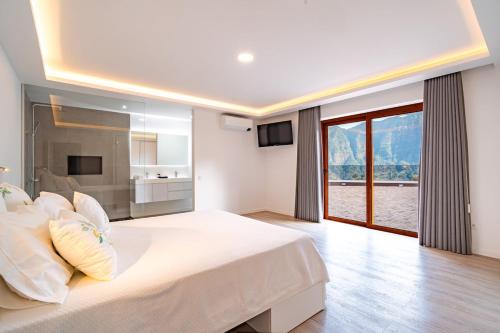 Ένα ή περισσότερα κρεβάτια σε δωμάτιο στο Vilaugusto