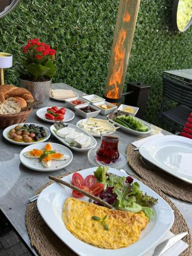 a table with plates of food on it at Casa Florya Suites in Istanbul