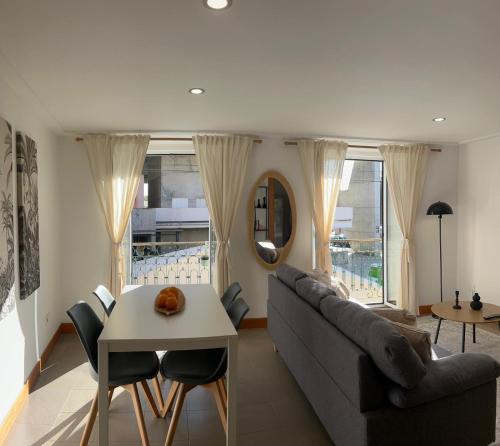 a living room with a couch and a table at Belém Cozy Apartments by Soulplaces in Lisbon
