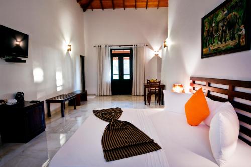 Ένα ή περισσότερα κρεβάτια σε δωμάτιο στο Melheim Kandy Villas