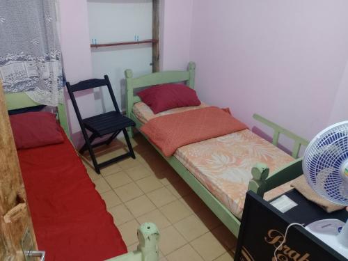Ένα ή περισσότερα κρεβάτια σε δωμάτιο στο Hostel & Cia Itanhaém