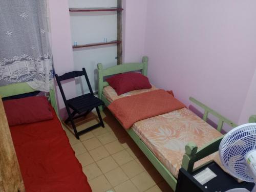 Ένα ή περισσότερα κρεβάτια σε δωμάτιο στο Hostel & Cia Itanhaém