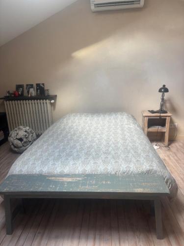 Postel nebo postele na pokoji v ubytování Les collines de chandieu