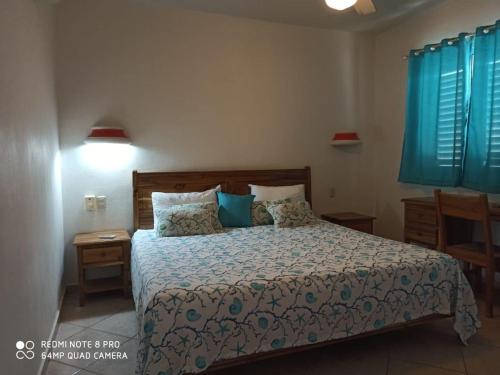 Ένα ή περισσότερα κρεβάτια σε δωμάτιο στο Beachfront apartment