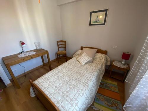 Postel nebo postele na pokoji v ubytování Les Iris