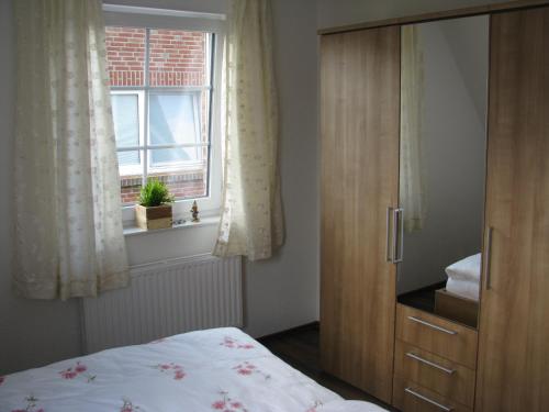 Voodi või voodid majutusasutuse Ferienhaus Süderhus Nordstrand toas