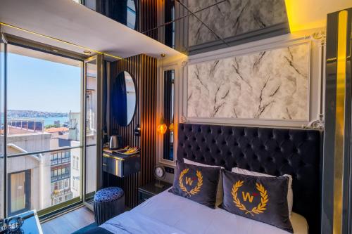 En eller flere senge i et værelse på The Wind Beşiktaş